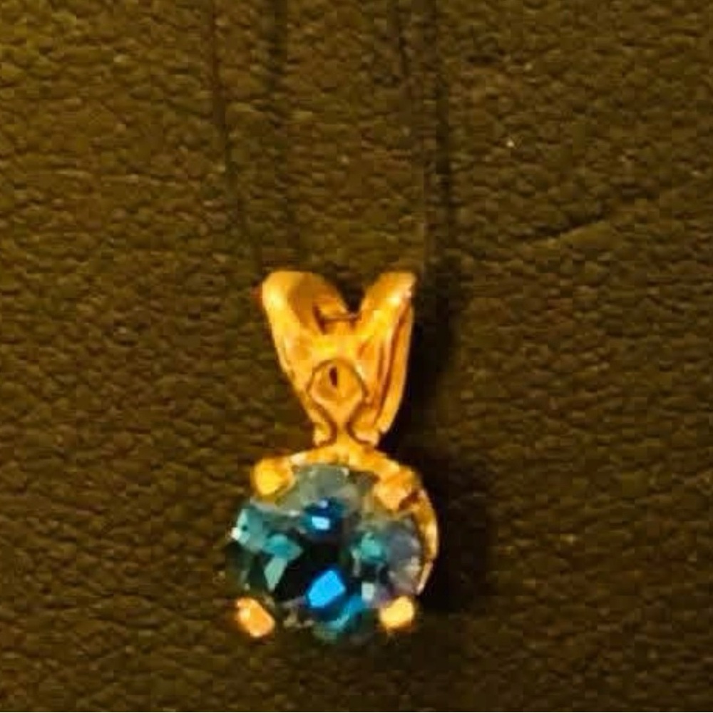 Elegant Blue Topaz and Gold Pendant Necklace
